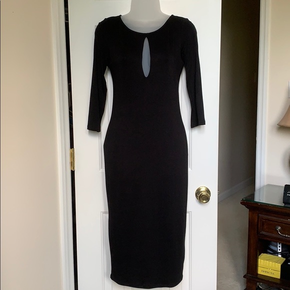 Sleek long lined black dress. NWOT